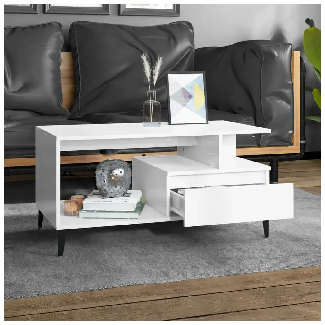 Modern white wood coffee table with open shelf, drawer, and black legs in stylish living room