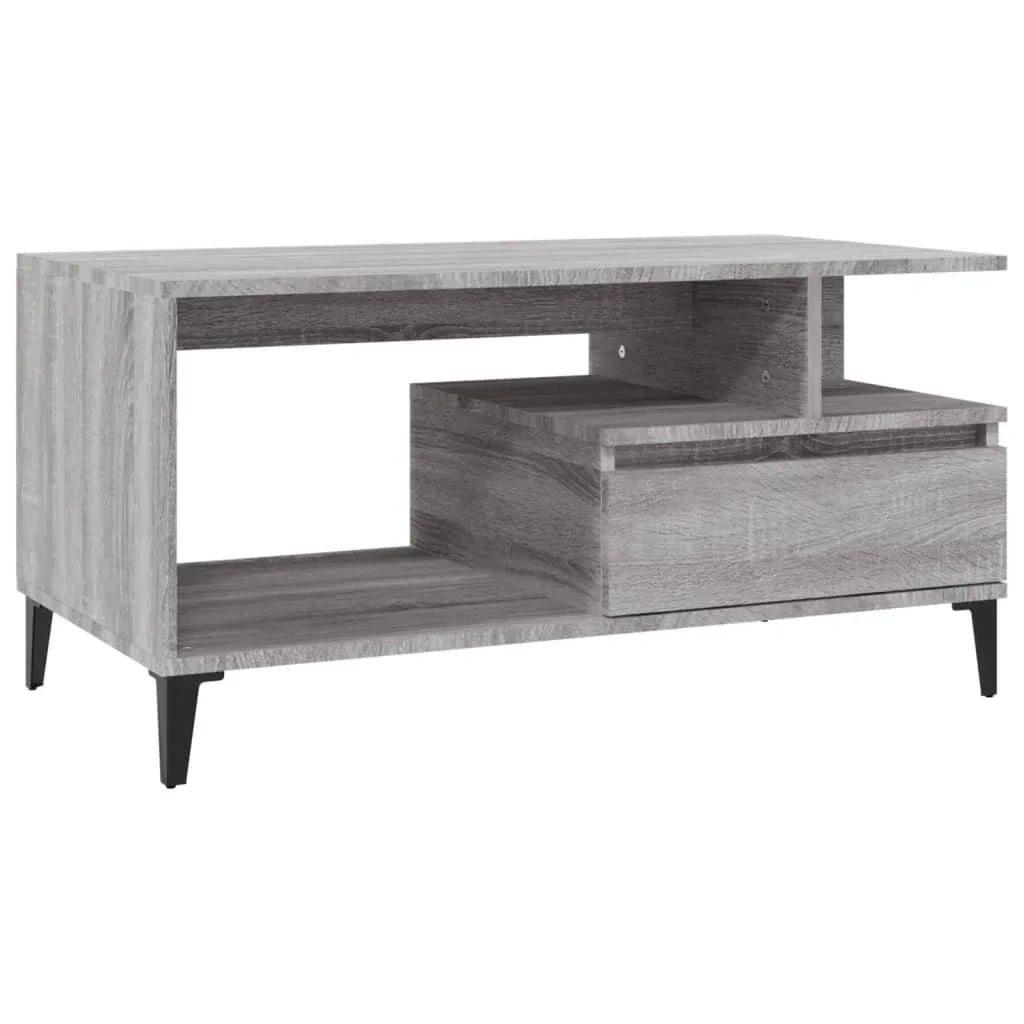 Modern grey wood TV unit with open shelf, drawer storage, and black legs from Bert Joseph