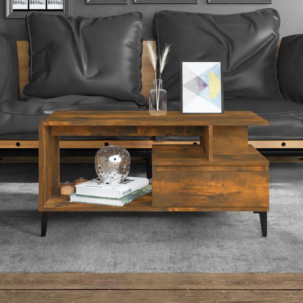 Modern brown wood coffee table with open shelving, decorative accents, and sleek black legs in a stylish living room from Bert Joseph.