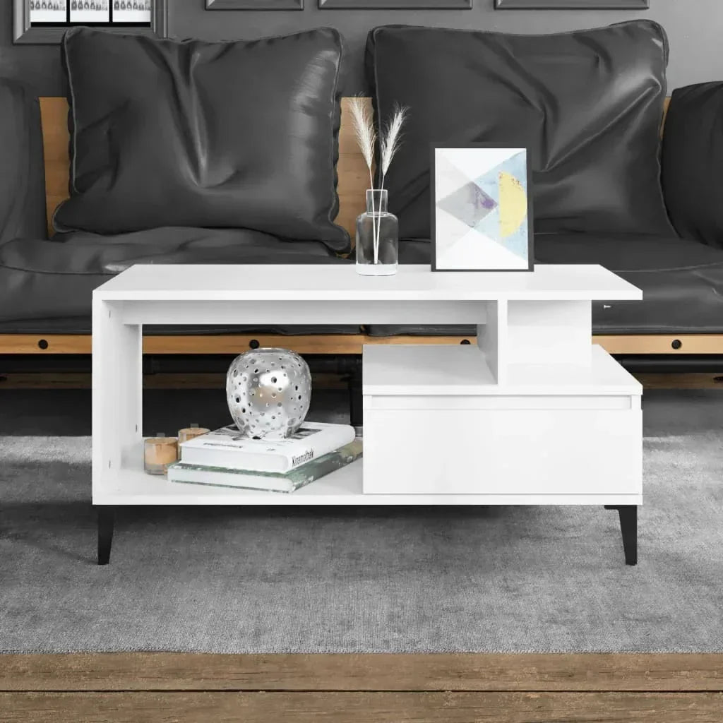 Modern white wood coffee table with open shelving and drawer, black legs, in stylish living room