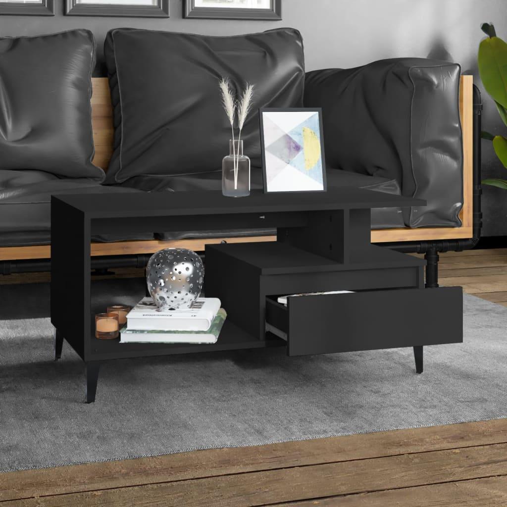 Modern black wood coffee table with open shelf and drawer, styled in a contemporary living room