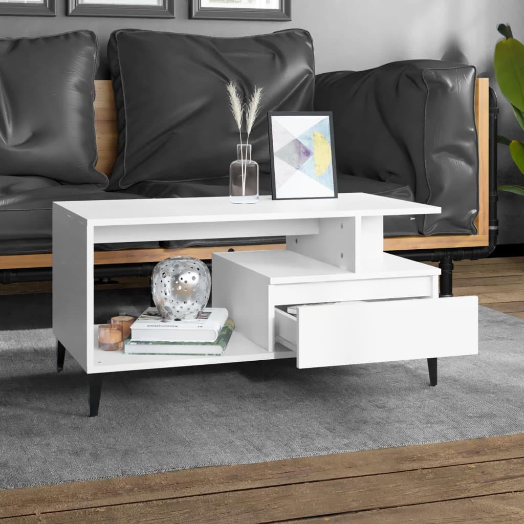 Modern white wood coffee table with open shelf and drawer, black legs, in stylish living room